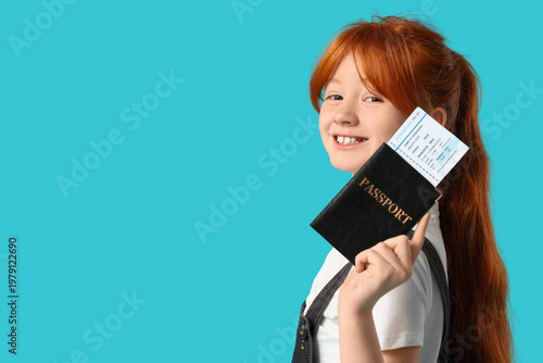 Cute girl with passport on ...