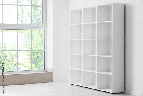 Empty bookshelf near light ...
