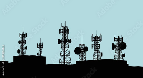 Silhouette of telecommunication towers and radio masts on building rooftop under clear sky for network connection concept