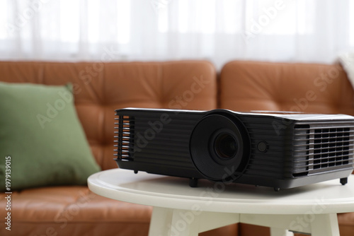 Black projector on table in...