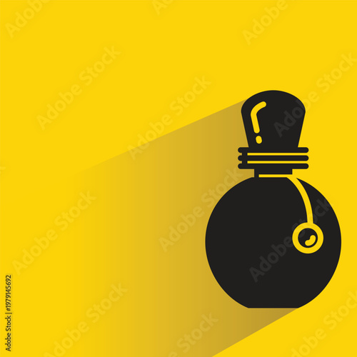 perfume spray bottle with drop shadow in yellow background