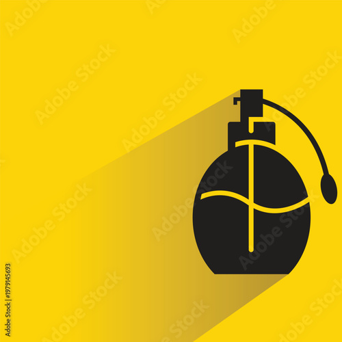 perfume spray bottle with drop shadow in yellow background