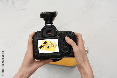 Female photographer with ca...