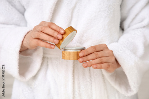 Young woman with jar of cos...