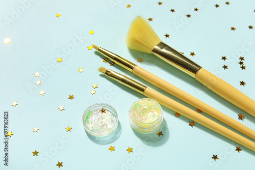 Makeup brushes, jar of glit...