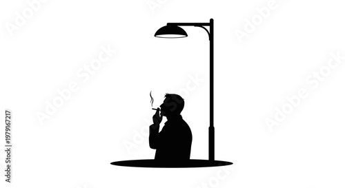 Man smoking under street light.