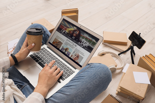 Female blogger using laptop...