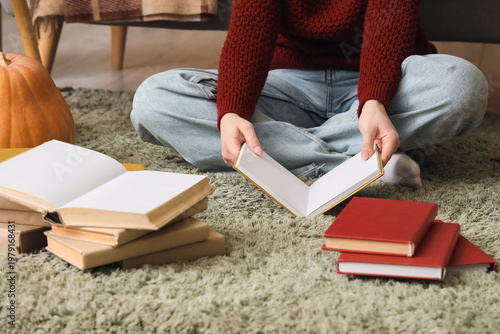 Woman with books sitting on...