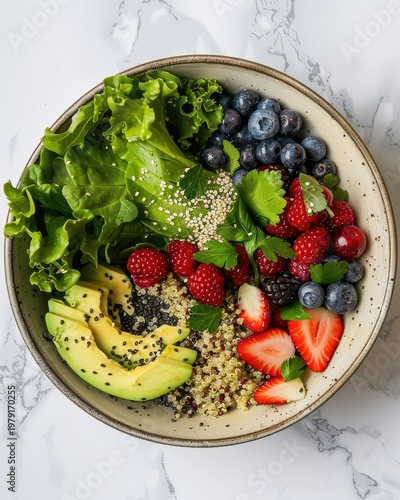 Healthy and vibrant breakfast bowl with fresh berries, avocado, and quinoa.