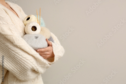 Woman holding colorful knit...