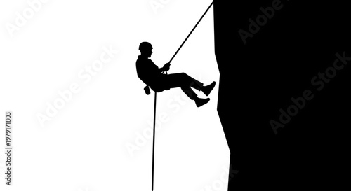 Man Rappelling Down a Cliff.