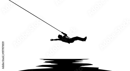 Man ziplining over water silhouette.
