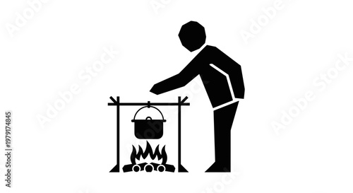 Man cooking over open fire.