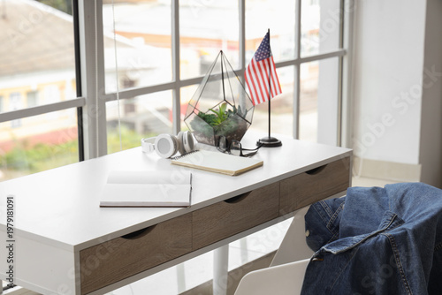 Table with notebooks and US...