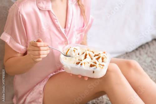 Young woman with ice cream ...