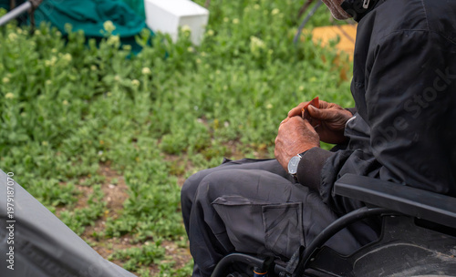 Fotografie Elderly person in wheelchair embodying concepts of homelessness and vulnerabilit