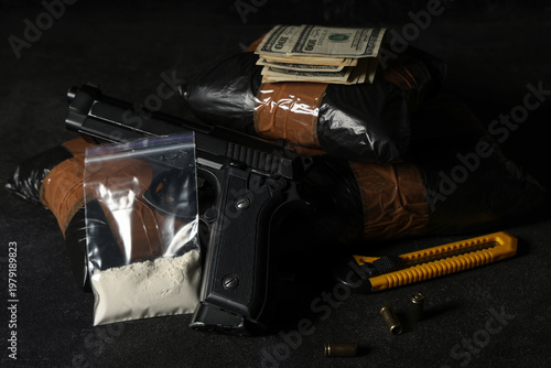Drug packages with gun, mon...