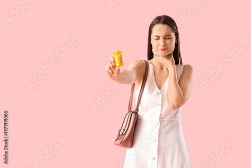 Young woman with pills for ...
