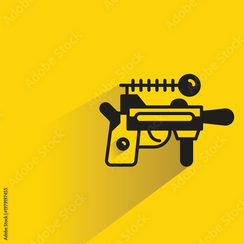 space gun icon with shadow on yellow background