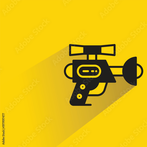 space gun icon with shadow on yellow background
