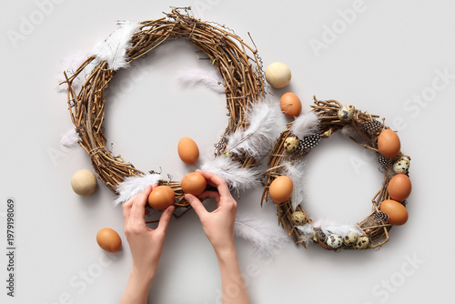 Woman making Easter wreaths...