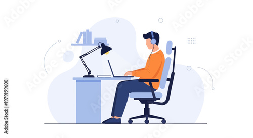 Man Working on Laptop with Headphones at Desk, Modern Office Setup