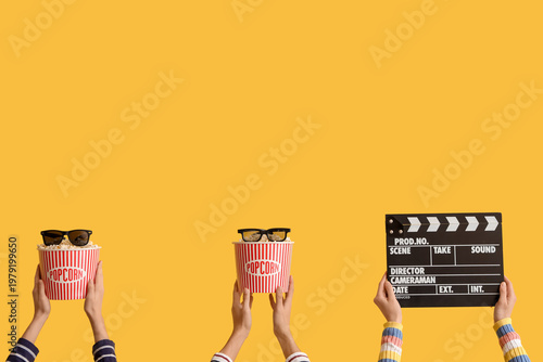 Hands with movie clapper, b...
