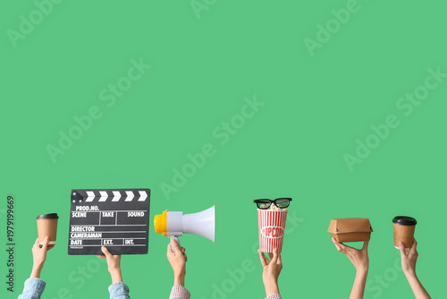 Many hands with movie clapp...