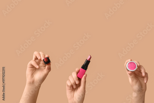 Female hands with lipsticks...