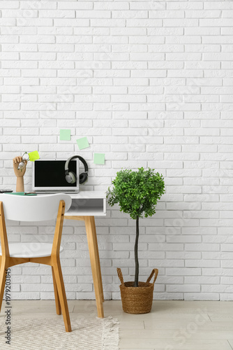 Stylish workplace with hous...