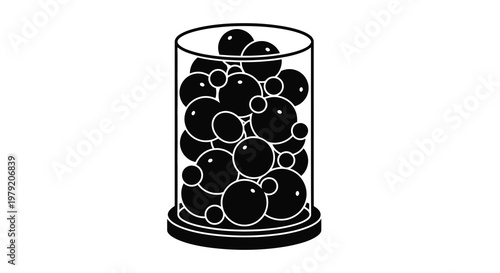 A cylindrical glass container filled with numerous black spherical objects
