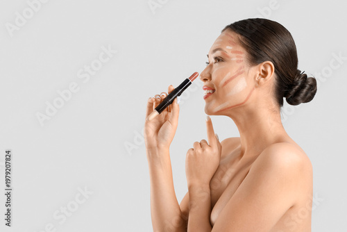 Young Asian woman with cont...