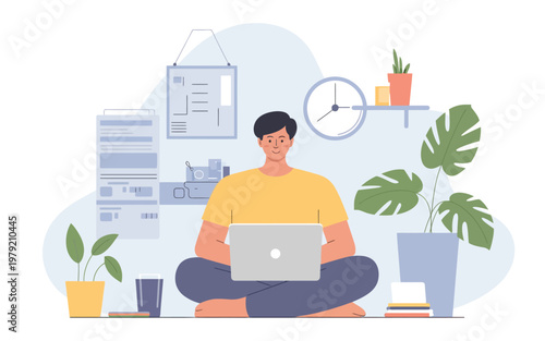 Man working on laptop seated in lotus position in a modern office space