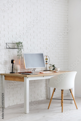 Stylish workplace with mode...