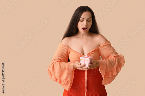 Surprised young woman with ...