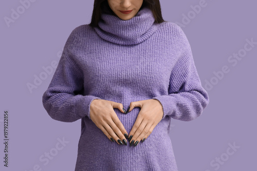 Happy pregnant woman making...