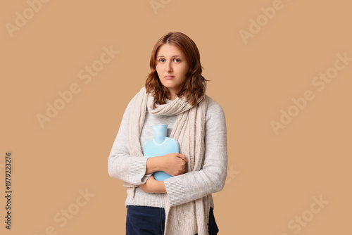 Ill young woman with hot wa...