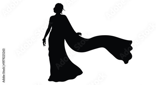 Elegant woman in a flowing sari dramatically captured as a silhouette