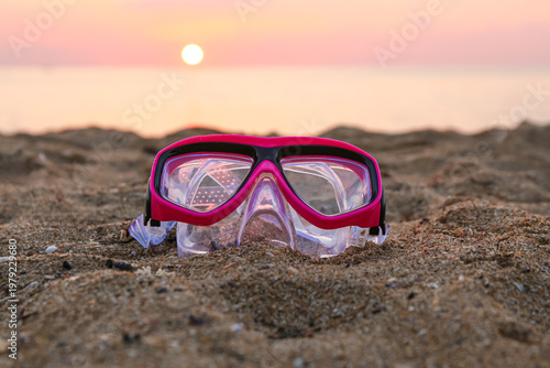 New swimming mask on sand n...