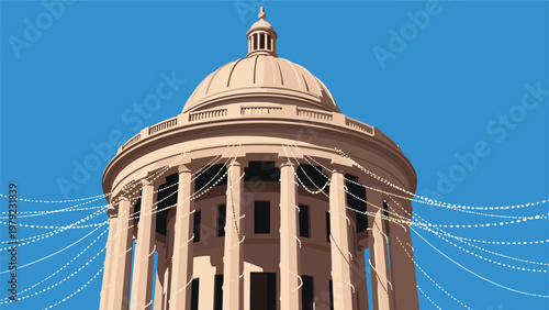 Architectural detail of a grand classical dome with many strings of lights draped across its columns against a clear blue sky.