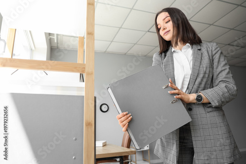 Young businesswoman with fo...
