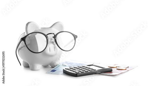 Piggy bank with money and calculator isolated on white background