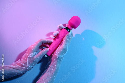 Woman with vibrator on colo...