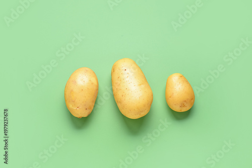Three fresh yellow potatoes...