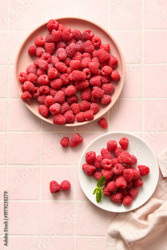 Plates with fresh raspberri...