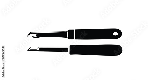 Two black tools for leatherwork presented as a stark silhouette