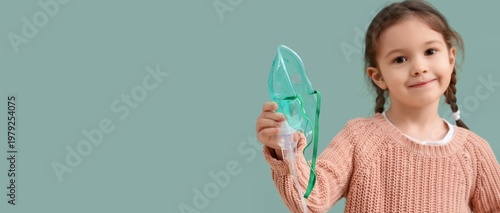 Cute little girl holding ne...