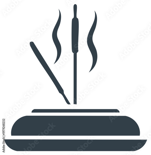 Incense sticks burning on a burner with smoke rising