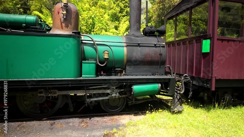 Green Steam Train With Vintage Passenger Car