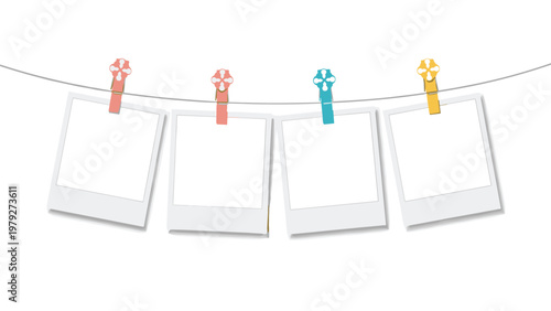 Row of four blank instant photo frames hanging from a wire with colorful decorative clips on a clean white background.
